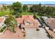 Aerial view of a two-story home, three-car garage and well-manicured landscaping at 1587 Bermuda Dunes Dr, Boulder City, NV 89005