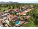 This house features a kidney shaped pool, patio, desert landscaping, and a view of the mountains at 1587 Bermuda Dunes Dr, Boulder City, NV 89005