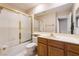 Bathroom featuring a combined shower and tub, vanity with sink, and large mirror at 1587 Bermuda Dunes Dr, Boulder City, NV 89005