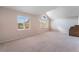 Bedroom with vaulted ceiling and natural light from windows, and neutral carpet, perfect for a relaxing space at 1587 Bermuda Dunes Dr, Boulder City, NV 89005