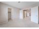 Spacious bedroom with plush carpet, closet, and doorways leading to other parts of the house at 1587 Bermuda Dunes Dr, Boulder City, NV 89005