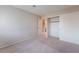 Empty bedroom with neutral carpet and a sliding door closet at 1587 Bermuda Dunes Dr, Boulder City, NV 89005