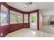Inviting dining area with white tile flooring and lots of windows providing backyard views at 1587 Bermuda Dunes Dr, Boulder City, NV 89005