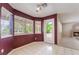 Inviting dining area with white tile flooring and lots of windows providing backyard views at 1587 Bermuda Dunes Dr, Boulder City, NV 89005