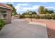 Spacious driveway featuring a basketball hoop and appealing landscaping at 1587 Bermuda Dunes Dr, Boulder City, NV 89005
