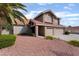 Charming two-story home with well-maintained desert landscaping and an attached two-car garage at 1587 Bermuda Dunes Dr, Boulder City, NV 89005