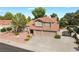 Charming two-story home featuring a large driveway and beautiful desert landscaping at 1587 Bermuda Dunes Dr, Boulder City, NV 89005
