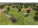 Scenic view of a lush golf course with mature trees, sand traps, and a tranquil water feature at 1587 Bermuda Dunes Dr, Boulder City, NV 89005