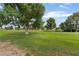 Picturesque view of sprawling greenspace adorned with mature trees at 1587 Bermuda Dunes Dr, Boulder City, NV 89005