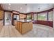 Bright kitchen with tile floors, wood cabinets, stainless steel appliances, and a large island at 1587 Bermuda Dunes Dr, Boulder City, NV 89005