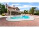 Backyard oasis featuring a large pool and spa perfect for relaxation and entertaining guests at 1587 Bermuda Dunes Dr, Boulder City, NV 89005