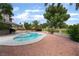 Wonderful backyard pool and spa with mature trees and charming landscaping at 1587 Bermuda Dunes Dr, Boulder City, NV 89005