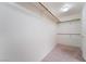 Walk-in closet featuring rods for hanging clothes and carpeted floors at 1587 Bermuda Dunes Dr, Boulder City, NV 89005