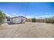 Large backyard with fresh wood fence surrounding the yard and a storage shed at 1600 E Mcdonald Ave, North Las Vegas, NV 89030