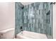 Tiled shower with a rainfall shower head and built-in niche at 1600 E Mcdonald Ave, North Las Vegas, NV 89030