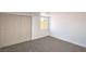 Neutral bedroom featuring carpet flooring, closet, and a window at 1600 E Mcdonald Ave, North Las Vegas, NV 89030