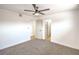 Neutral bedroom featuring a ceiling fan, carpet flooring, and closet at 1600 E Mcdonald Ave, North Las Vegas, NV 89030