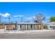 Exterior view of a single-story home with fencing, landscaping, and a well-maintained front yard at 1600 E Mcdonald Ave, North Las Vegas, NV 89030