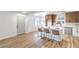 Kitchen with island seating, stainless steel appliances, natural wood cabinets, and bright light at 1600 E Mcdonald Ave, North Las Vegas, NV 89030