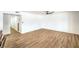 Spacious living room with light wood floors and white walls ready to be customized at 1600 E Mcdonald Ave, North Las Vegas, NV 89030