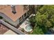 Aerial view of backyard with tile roof, jacuzzi, trees, and patio at 175 Palta Ct, Henderson, NV 89074