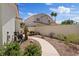Backyard with desert landscaping, garden bed, and paver pathway at 175 Palta Ct, Henderson, NV 89074