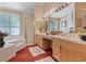 Luxurious bathroom with a soaking tub, shower, double vanity, and bright lighting for a spa-like experience at 175 Palta Ct, Henderson, NV 89074