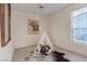 Cozy bedroom featuring a teepee, rustic decor, carpeted floors, and a window providing natural light at 175 Palta Ct, Henderson, NV 89074