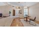 Sunlit foyer leads to dining area featuring hardwood floors and arched doorway, creating a welcoming atmosphere at 175 Palta Ct, Henderson, NV 89074