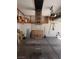 A well-lit garage featuring overhead storage, a ladder, and a convenient attic access point, ready for storage and organization at 175 Palta Ct, Henderson, NV 89074