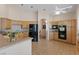 Spacious kitchen featuring modern appliances, tile flooring, ample counter space, and an inviting breakfast bar at 175 Palta Ct, Henderson, NV 89074