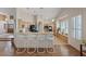 Open-concept kitchen featuring breakfast bar, tile flooring, and modern appliances, perfect for culinary enthusiasts at 175 Palta Ct, Henderson, NV 89074