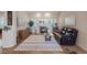 Comfortable living room with fireplace, hardwood floors, and plantation shutters, providing a cozy and inviting space at 175 Palta Ct, Henderson, NV 89074