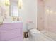 Bathroom featuring a shower with glass doors, tile surround, and a lavender vanity at 1990 Country Cove Ct, Las Vegas, NV 89135
