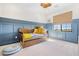 Bedroom featuring board and batten detail, neutral walls, and light-filled windows at 1990 Country Cove Ct, Las Vegas, NV 89135