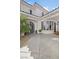Exterior courtyard featuring a wrought iron doorway, bay window, and tiled overhang at 1990 Country Cove Ct, Las Vegas, NV 89135