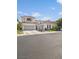 Charming two-story home with a neutral color palette, three-car garage, well-maintained landscaping, and beautiful curb appeal at 1990 Country Cove Ct, Las Vegas, NV 89135