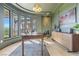 Home office with large windows, a wooden desk, and custom trim at 1990 Country Cove Ct, Las Vegas, NV 89135