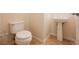 Cozy powder room with a pedestal sink and tile flooring at 2008 Royal Gardens Pl, North Las Vegas, NV 89084