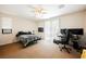 Bright bedroom featuring natural light, a ceiling fan, and carpet flooring at 2008 Royal Gardens Pl, North Las Vegas, NV 89084
