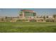 Aliante Casino and Hotel architecture featuring desert landscaping and grassy area in foreground at 2008 Royal Gardens Pl, North Las Vegas, NV 89084