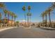 The gated entrance of the Springdale community featuring manicured palm trees at 2008 Royal Gardens Pl, North Las Vegas, NV 89084