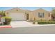 Inviting single-story home with a two-car garage, easy-care desert landscaping, and a neutral exterior at 2008 Royal Gardens Pl, North Las Vegas, NV 89084
