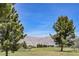 Scenic shot of a well-maintained golf course with mountain backdrop and clear blue skies at 2008 Royal Gardens Pl, North Las Vegas, NV 89084