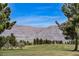 Picturesque golf course with scenic mountain views in the distance on a sunny day at 2008 Royal Gardens Pl, North Las Vegas, NV 89084