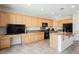 Bright kitchen featuring granite countertops, stainless steel appliances, and ample cabinet space at 2008 Royal Gardens Pl, North Las Vegas, NV 89084