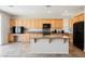 Well-lit kitchen with granite countertops, stainless steel appliances, and plenty of storage at 2008 Royal Gardens Pl, North Las Vegas, NV 89084