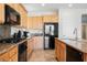 Charming kitchen with granite countertops and stainless steel appliances at 2008 Royal Gardens Pl, North Las Vegas, NV 89084