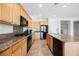 Stylish kitchen with granite countertops, stainless steel appliances, and modern fixtures at 2008 Royal Gardens Pl, North Las Vegas, NV 89084