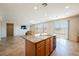 Living area featuring a kitchen with an island and tile floors at 2008 Royal Gardens Pl, North Las Vegas, NV 89084